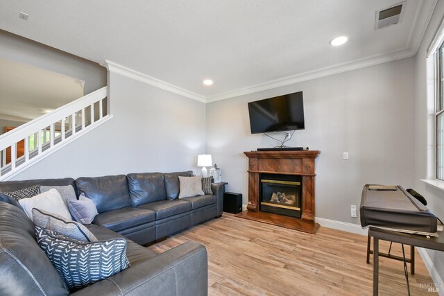 712 Tahoe Ct, Fairfield, CA 94534 - living room with light wood finished floors, plenty of natural light, stairs, crown molding, and recessed lighting