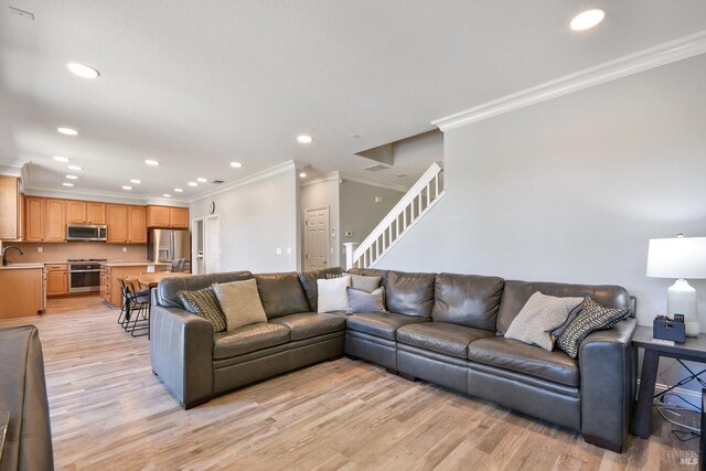 712 Tahoe Ct, Fairfield, CA 94534 - living area with ornamental molding, light wood finished floors, stairway, and recessed lighting