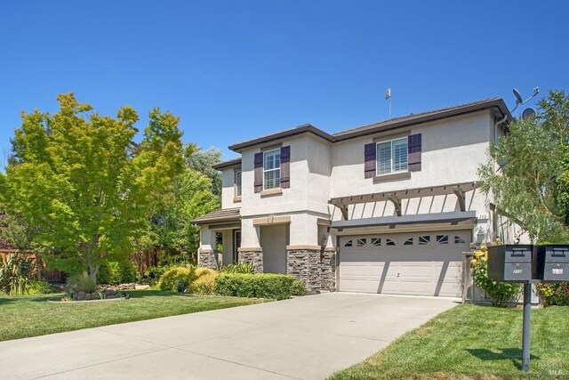 712 Tahoe Ct, Fairfield, CA 94534 - view of front of home with an attached garage, driveway, stucco siding, a front yard, and stone siding