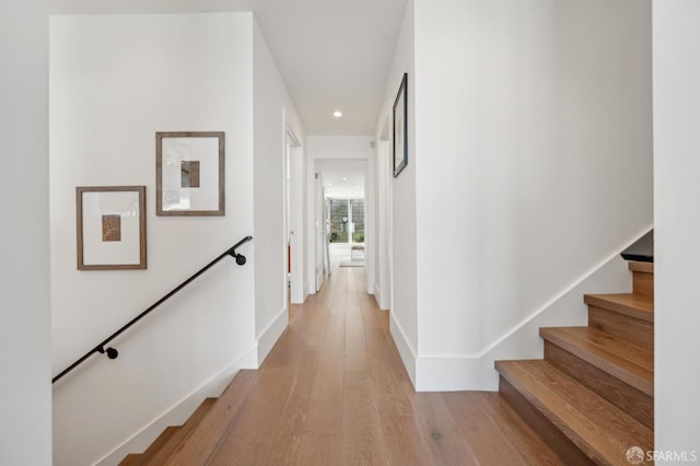 56 Aztec St, San Francisco, CA 94110 - corridor featuring recessed lighting, light wood finished floors, baseboards, and stairs
