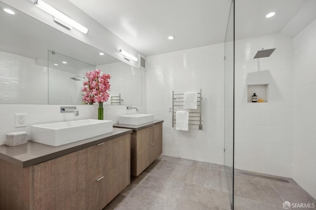 56 Aztec St, San Francisco, CA 94110 - full bath with walk in shower, radiator, vanity, a towel warming rack, and backsplash