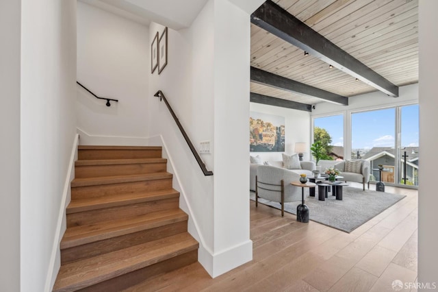 56 Aztec St, San Francisco, CA 94110 - stairs with beamed ceiling, wood finished floors, and baseboards