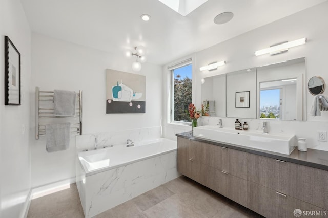 56 Aztec St, San Francisco, CA 94110 - bathroom featuring a garden tub, double vanity, and a towel warming rack