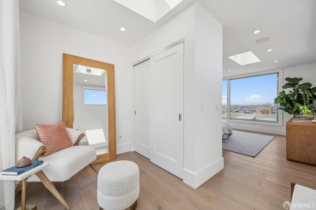 56 Aztec St, San Francisco, CA 94110 - living area featuring a skylight, light wood-type flooring, recessed lighting, and baseboards
