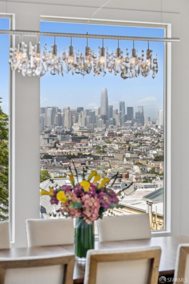 56 Aztec St, San Francisco, CA 94110 - dining space featuring a skyline view and a chandelier