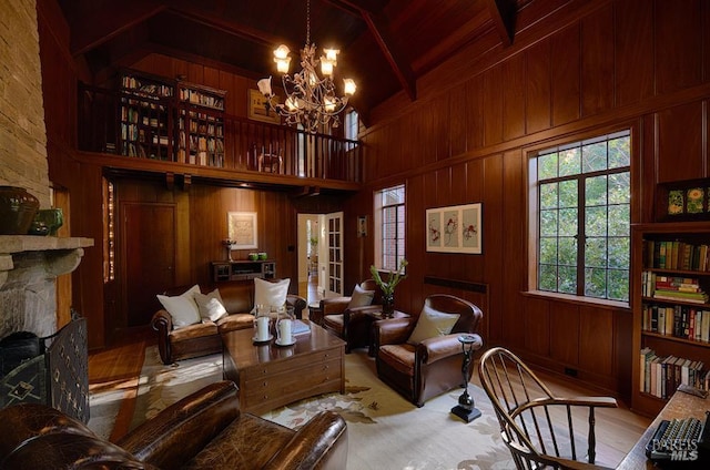 3850 Montecito Ave, Santa Rosa, CA 95404 - living room featuring a chandelier, wooden walls, high vaulted ceiling, a stone fireplace, and wood ceiling with exposed beams