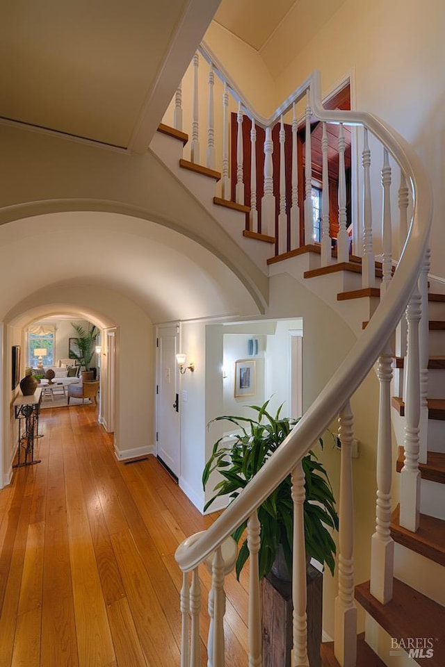 3850 Montecito Ave, Santa Rosa, CA 95404 - foyer entrance with light wood-type flooring, arched walkways, stairs, and baseboards