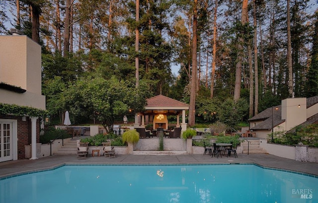 3850 Montecito Ave, Santa Rosa, CA 95404 - outdoor pool with a gazebo, outdoor dining space, a patio area, and view of scattered trees