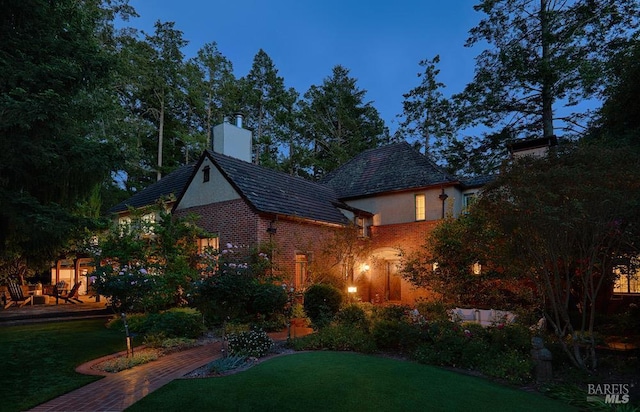 3850 Montecito Ave, Santa Rosa, CA 95404 - view of front facade featuring a chimney, a front lawn, and brick siding