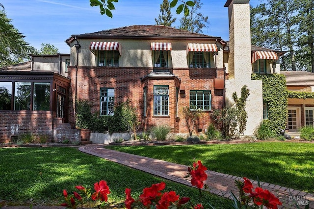 3850 Montecito Ave, Santa Rosa, CA 95404 - view of front of property with a chimney, stucco siding, brick siding, and a front yard