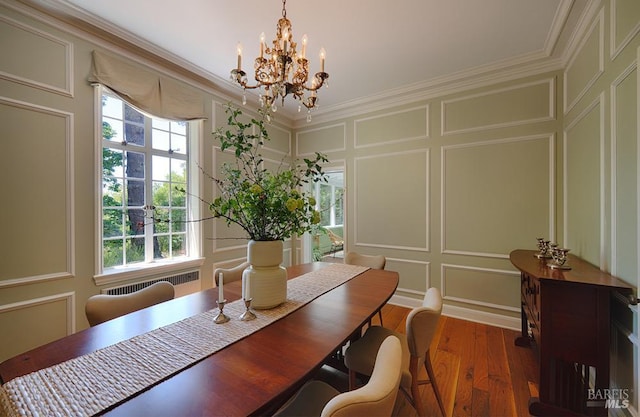 3850 Montecito Ave, Santa Rosa, CA 95404 - dining room with a decorative wall, a chandelier, crown molding, wood finished floors, and radiator