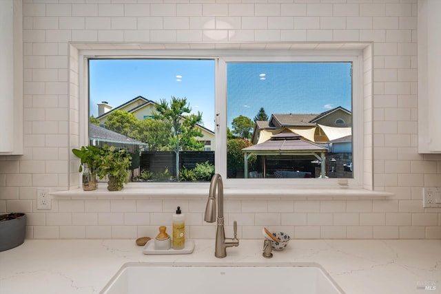 4260 Plass Dr, Napa, CA 94558 - kitchen view of a sink, tasteful backsplash, and light stone countertops