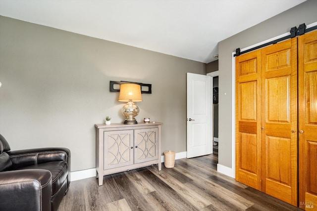 4260 Plass Dr, Napa, CA 94558 - living area with dark wood-style floors, baseboards, and a barn door