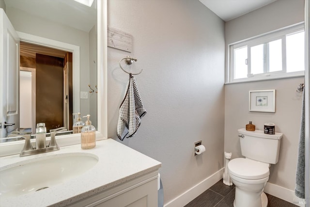 4260 Plass Dr, Napa, CA 94558 - bathroom with baseboards, vanity, and toilet