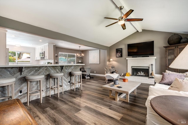 4260 Plass Dr, Napa, CA 94558 - living room with dark wood-style floors, ceiling fan, a fireplace, baseboards, and a chandelier