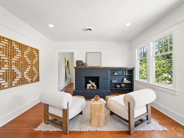 9 Park St, San Rafael, CA 94901 - sitting room featuring a brick fireplace, baseboards, wood finished floors, and recessed lighting