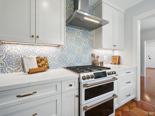 9 Park St, San Rafael, CA 94901 - kitchen with high end range, wall chimney exhaust hood, tasteful backsplash, and white cabinetry