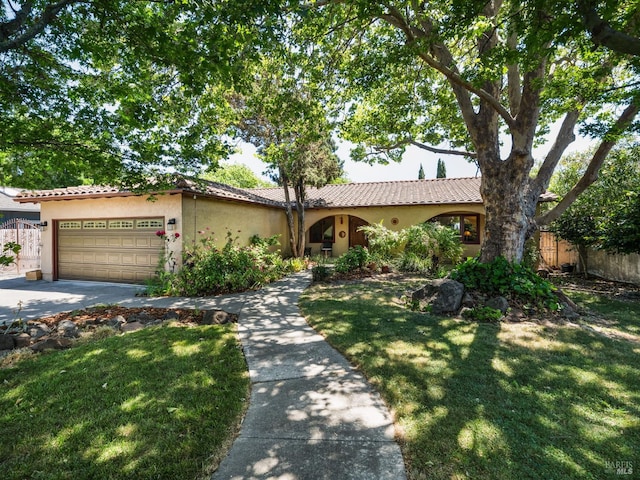 1010 Easum Dr, Napa, CA 94558 - view of front of home with stucco siding, a garage, a tile roof, and driveway