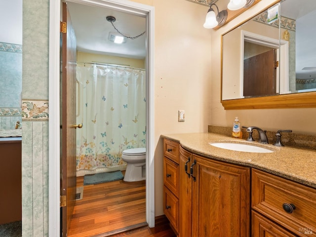 1010 Easum Dr, Napa, CA 94558 - full bath with toilet, vanity, wood finished floors, and a shower with curtain