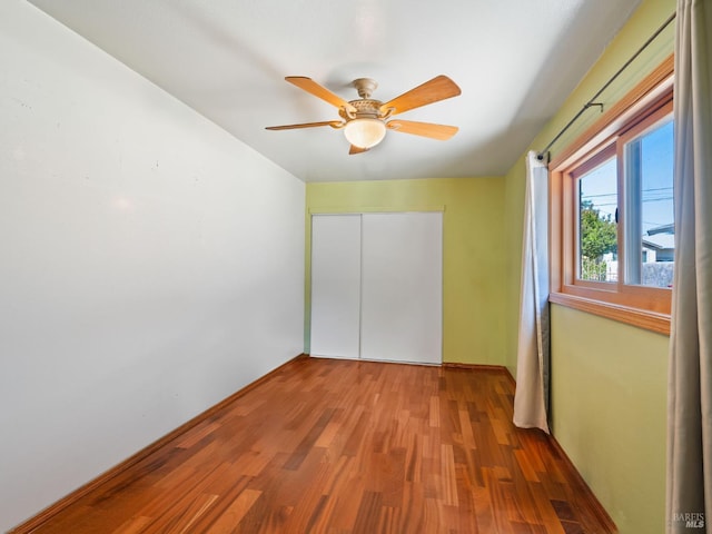 1010 Easum Dr, Napa, CA 94558 - unfurnished bedroom with wood finished floors, a closet, a ceiling fan, and baseboards