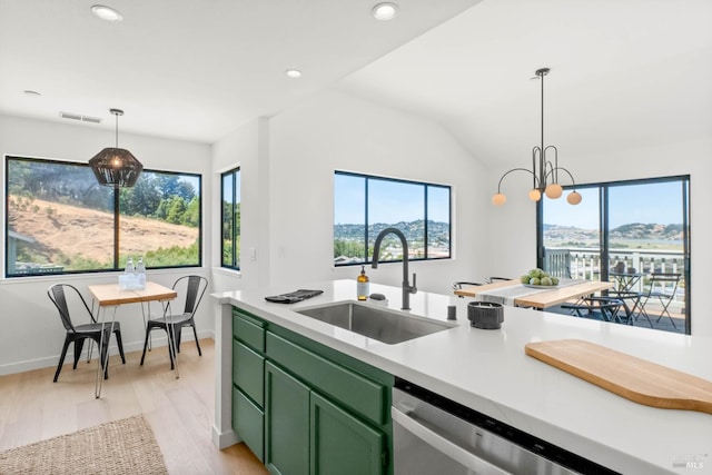 34 Laurel Dr, Corte Madera, CA 94925 - kitchen with green cabinetry, a sink, light countertops, light wood-style floors, and stainless steel dishwasher