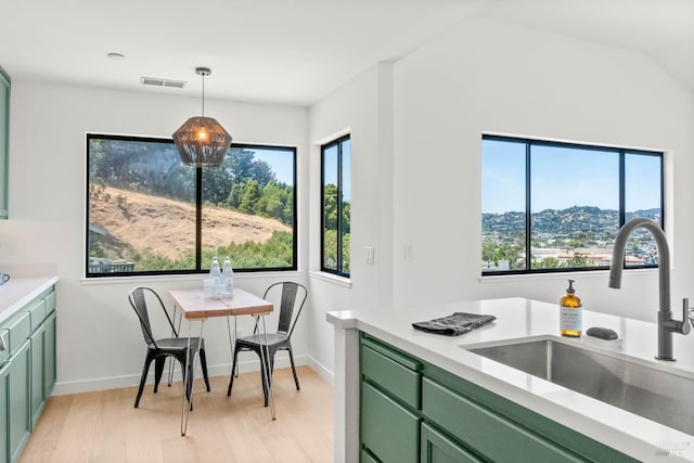 34 Laurel Dr, Corte Madera, CA 94925 - kitchen with green cabinetry, a sink, plenty of natural light, and light wood finished floors
