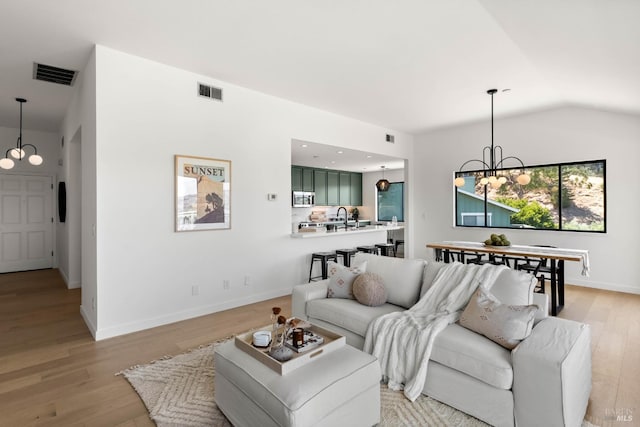 34 Laurel Dr, Corte Madera, CA 94925 - living room with a chandelier, light wood-type flooring, lofted ceiling, and baseboards