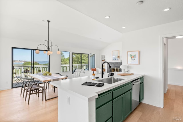 34 Laurel Dr, Corte Madera, CA 94925 - kitchen with green cabinetry, a sink, stainless steel dishwasher, a peninsula, and light wood finished floors