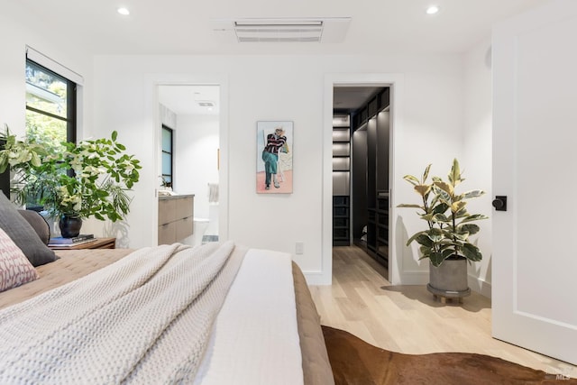 225 W Baltimore Ave, Larkspur, CA 94939 - bedroom with light wood-style floors, recessed lighting, baseboards, and connected bathroom