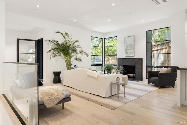 225 W Baltimore Ave, Larkspur, CA 94939 - living area with light wood-style floors, recessed lighting, and a premium fireplace