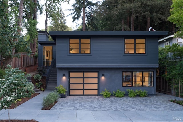 225 W Baltimore Ave, Larkspur, CA 94939 - contemporary house with an attached garage, decorative driveway, stairway, and stucco siding