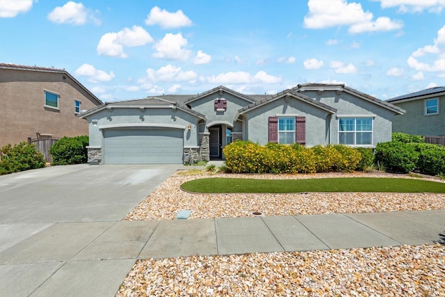 2234 Pullen Ln, Fairfield, CA 94533 - view of front of property featuring stucco siding, driveway, a garage, and stone siding