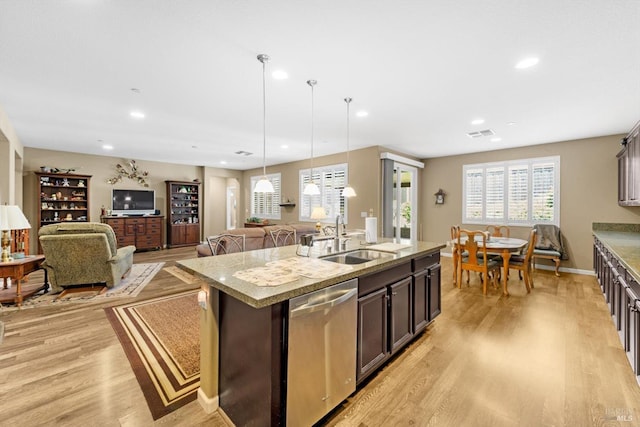 2234 Pullen Ln, Fairfield, CA 94533 - kitchen with stainless steel dishwasher, a sink, light wood-style flooring, a kitchen island with sink, and recessed lighting