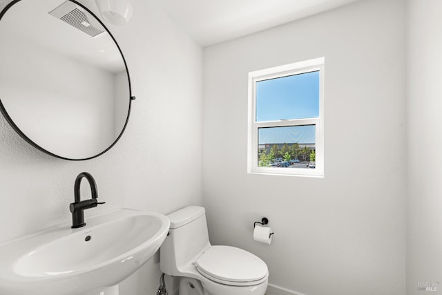 1480 Waterside Ln, Rohnert Park, CA 94928 - bathroom with a sink, toilet, and baseboards
