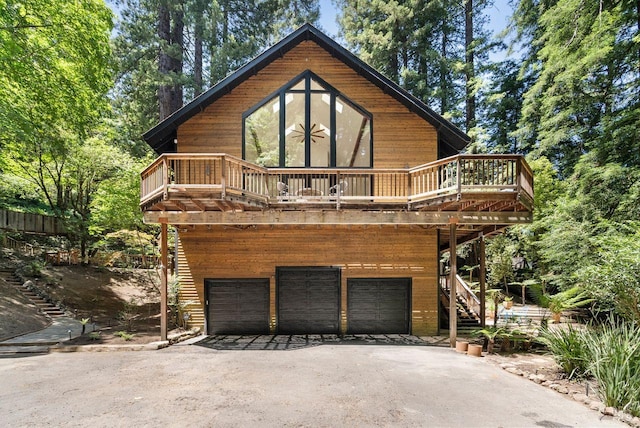 192 Carson Rd, Woodacre, CA 94973 - view of front of property featuring stairway, asphalt driveway, an attached garage, and a deck