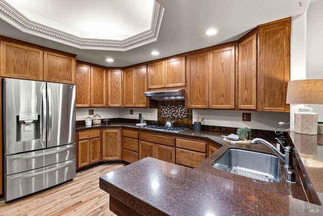 192 Carson Rd, Woodacre, CA 94973 - kitchen featuring stainless steel appliances, under cabinet range hood, a sink, brown cabinets, and recessed lighting