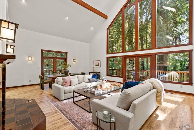 192 Carson Rd, Woodacre, CA 94973 - living area featuring high vaulted ceiling, beam ceiling, french doors, baseboards, and healthy amount of natural light