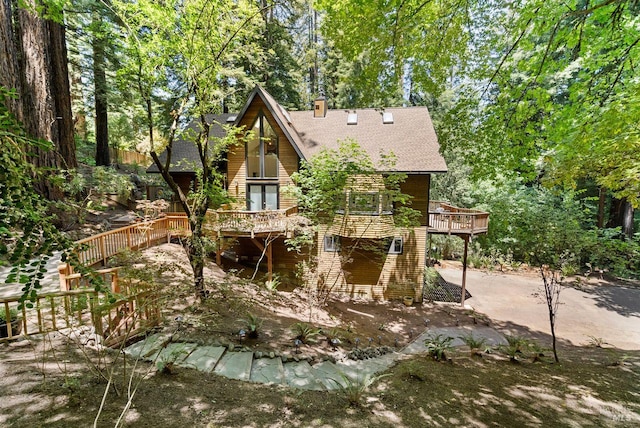 192 Carson Rd, Woodacre, CA 94973 - rear view of house with a wooden deck, roof with shingles, and a chimney