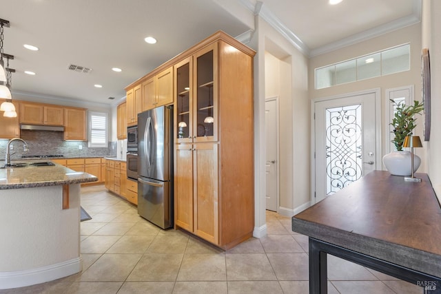 508 Riverwood Ln, Rio Vista, CA 94571 - kitchen with stainless steel appliances, under cabinet range hood, ornamental molding, a sink, and stone counters
