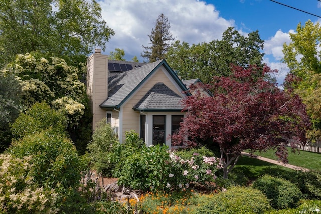 1330 Pine St, Saint Helena, CA 94574 - view of front of property with roof mounted solar panels, a chimney, and roof with shingles