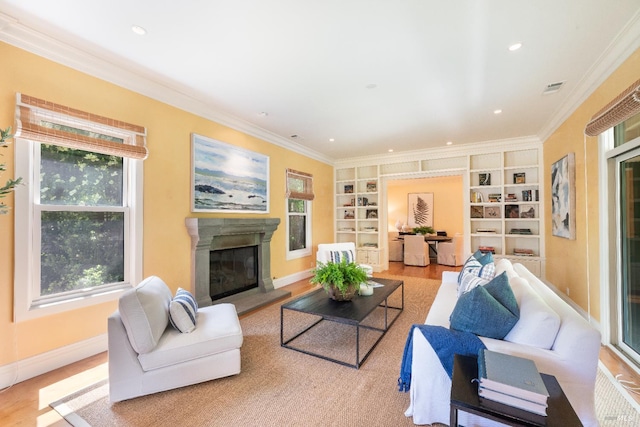 1330 Pine St, Saint Helena, CA 94574 - living area with healthy amount of natural light, built in features, a glass covered fireplace, ornamental molding, and wood finished floors