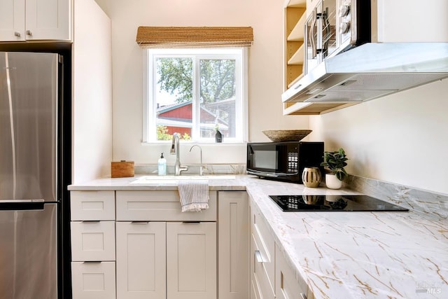 3051 Edison St, Graton, CA 95444 - kitchen with black appliances, exhaust hood, a sink, light stone countertops, and white cabinetry