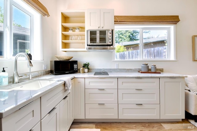 3051 Edison St, Graton, CA 95444 - kitchen featuring a sink, open shelves, black microwave, light stone counters, and light wood-style flooring