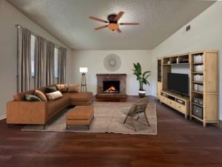 5972 Walerga Rd Unit 1, Sacramento, CA 95842 - living room featuring lofted ceiling, a lit fireplace, a ceiling fan, wood finished floors, and a textured ceiling
