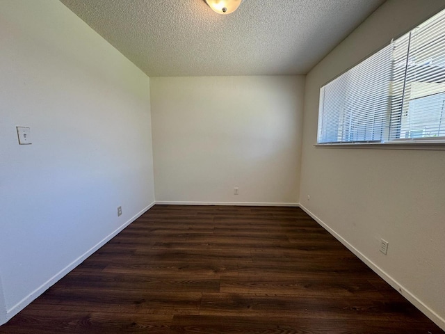 5972 Walerga Rd Unit 1, Sacramento, CA 95842 - empty room with a textured ceiling, dark wood-style floors, and baseboards