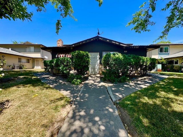 5972 Walerga Rd Unit 1, Sacramento, CA 95842 - view of front of property with a chimney and a front lawn