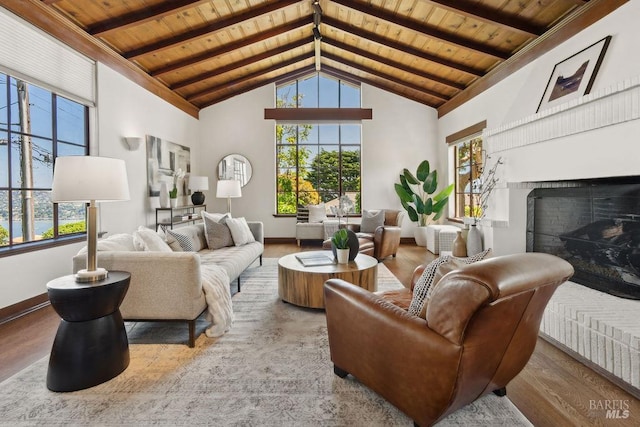 4 Cloud View Cir, Sausalito, CA 94965 - living area with wooden ceiling with exposed beams, healthy amount of natural light, a fireplace with raised hearth, wood finished floors, and high vaulted ceiling