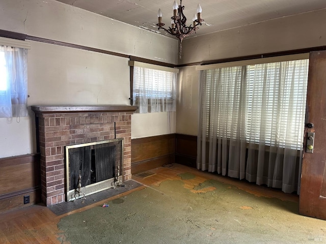 718 Monterey St, Vallejo, CA 94590 - unfurnished living room with healthy amount of natural light, a chandelier, and a fireplace