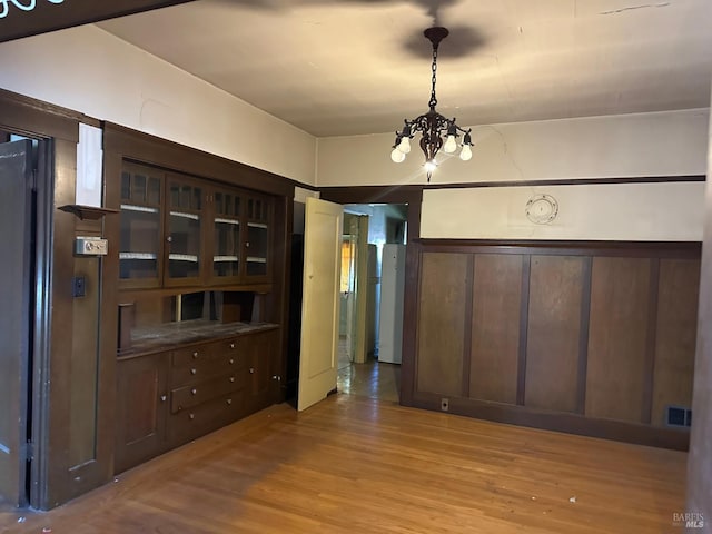 718 Monterey St, Vallejo, CA 94590 - unfurnished dining area featuring a chandelier and wood finished floors