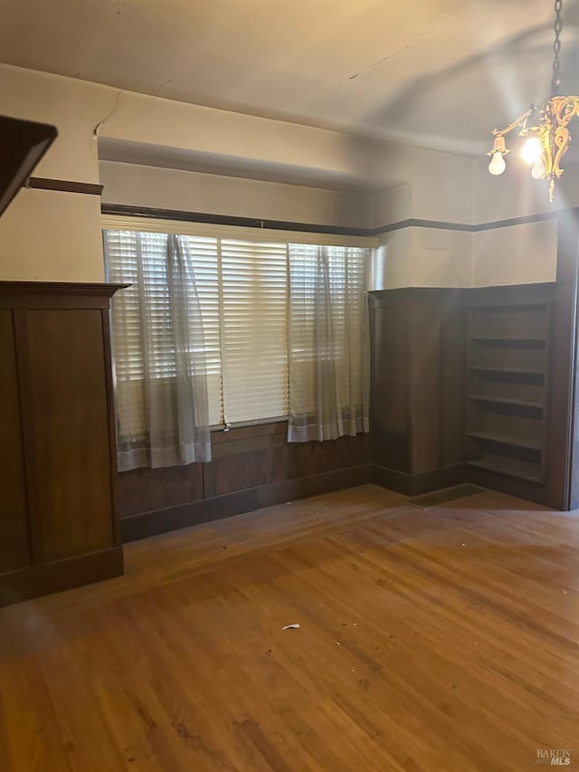 718 Monterey St, Vallejo, CA 94590 - unfurnished bedroom with wood finished floors and a chandelier